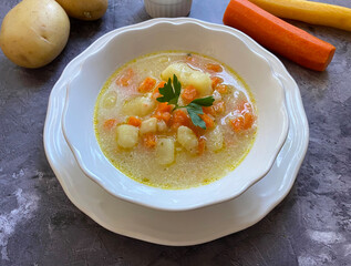 Viennese, healthy potato soup. This vegetarian version is made with carrot, onions, garlic, celery, potatoes, flour, vegetable soup, sour cream, vinegar and marjoram.
