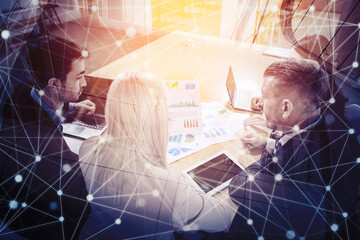 Double exposure of business team analyzing chart