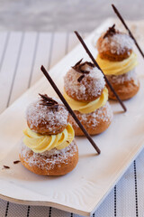 Religieuse French choux pastry in a row