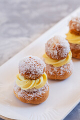 Religieuse French choux pastry in a row
