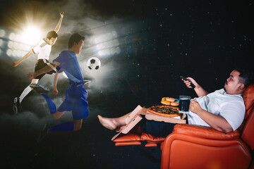 Obraz na płótnie Canvas Obese man watching football match with junk foods