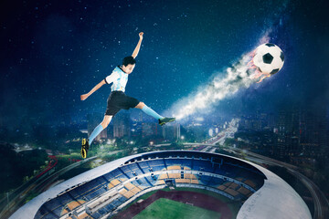 Fototapeta na wymiar Soccer player kicking a ball with power flame