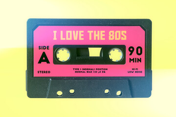 Illustration of a retro vintage cassette tape (obsolete audio technology) with the text I love the 80s.
