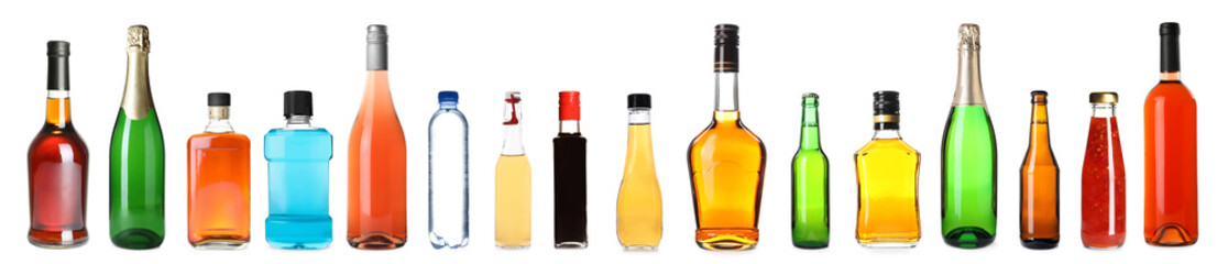 Obraz na płótnie Canvas Set of bottles with different liquids on white background. Banner design