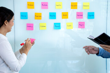 Businessmen and woman are standing
