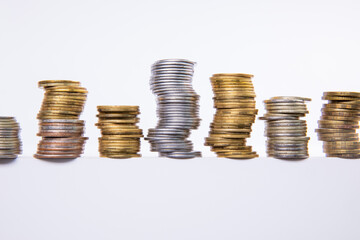 collection of colorful metal coins isolated on white background, close view