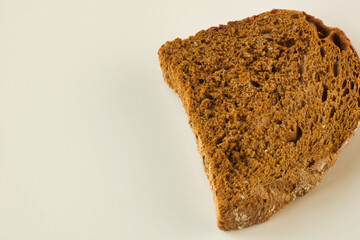 close up of one rye bread slice on white background