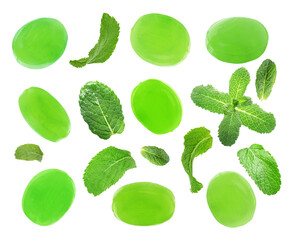 Set of mint hard candies and green leaves on white background
