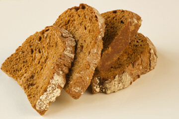 close up of dry rye bread slices isolated on white