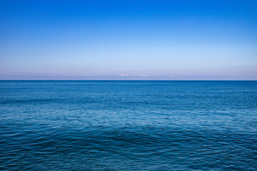 Sunrise on a summer warm morning at the sea in Sochi Russia.