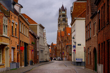 Bruges, Flanders, Belgium, Europe - October 1, 2019. Medieval ancient houses made of old bricks on ancient medieval street in Bruges (Brugge)