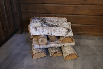 Fototapeta na wymiar birch firewood. Heap of several logs. selective focus