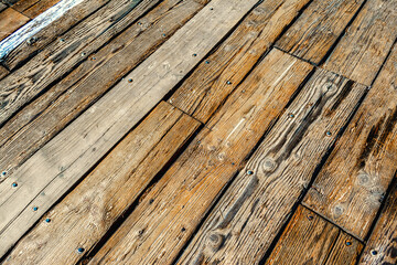 Obraz premium Detail of a wooden floor with old plank in Pacific Beach pier