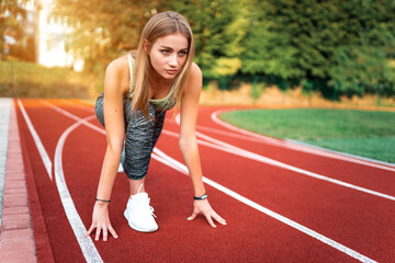 Slender girl getting ready to run