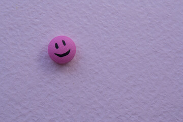 Pink smile tablet on a pink background