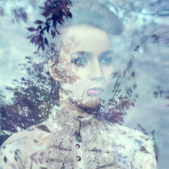 Tender sensual portrait of a girl with a haircut in a blooming garden.  Place for an inscription.