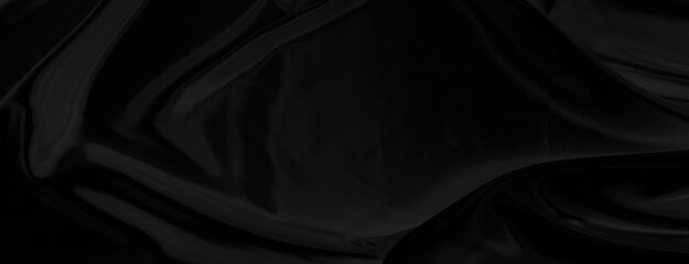 Fototapeta premium Black gray satin dark fabric texture luxurious shiny that is abstract silk cloth panorama background with patterns soft waves blur beautiful.