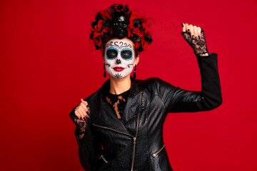 Scary young creepy lady calavera. wears artistic make-up for the feast of all the dead. Have fun...