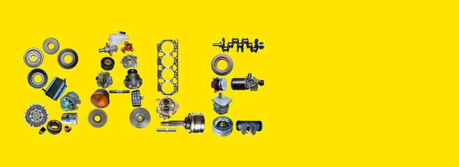 Sale label is written with car spare parts. Black friday concept for auto shop, repair shop on the...