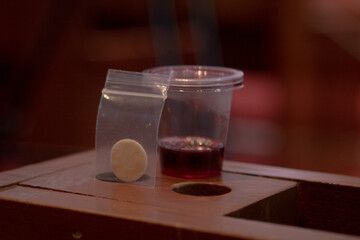Communion New Normal Style - In One Time Use Containers To Protect People From The Pandemic COVID-19