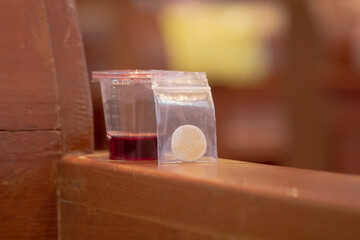 Communion New Normal Style - In One Time Use Containers To Protect People From The Pandemic COVID-19