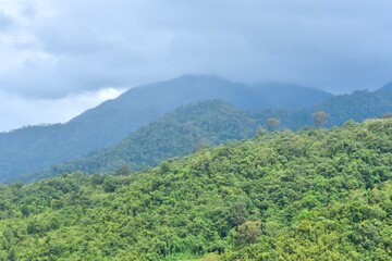 Fototapeta na wymiar Rain Clouds Over Mountains in Nan Province, Thailand