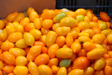 Fresh tomatoes on the counter in the store. Farmers fair