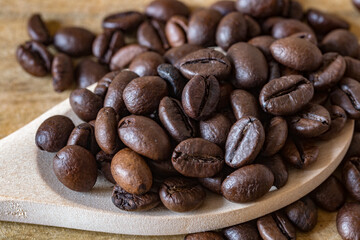 caffee beans in the wooden spoon