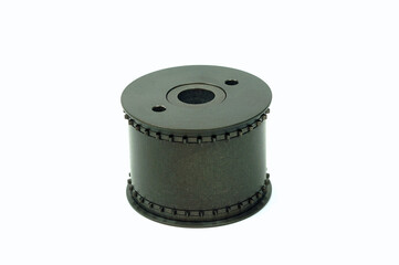 Close-Up vertical  view of a 35mm sprocket  tape playback and recoder of a westech retro sound studio machine.