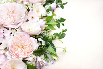 Delicate blossoming roses and flowers, blooming pastel festive frame background, soft pink bouquet floral card, toned	