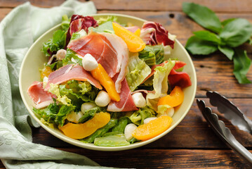 salad with fresh herbs, cheese and bacon