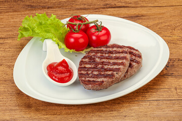 Grilled burger cutlet with sauce