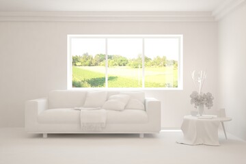 White living room with sofa and summer landscape in window. Scandinavian interior design. 3D illustration