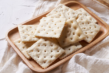 homemade square crackers on white table