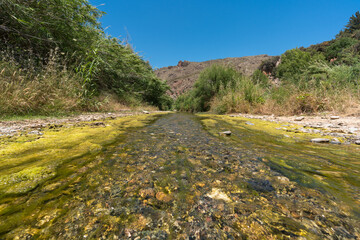 Fototapeta na wymiar water flowing down a river in southern Spain