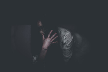 Portrait of asian woman make up ghost face with blood,Horror scene,Scary background,Halloween...