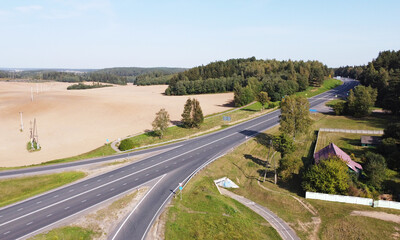 Top view of the long highway autobahn through the fields