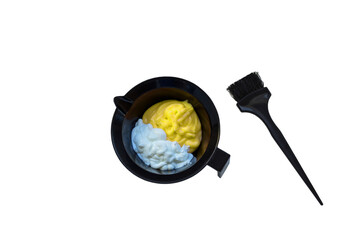 Mixing hair dye in a special plastic bowl. Concept is hair coloring. Isolated on white.