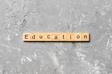 Education word written on wood block. Education text on cement table for your desing, concept