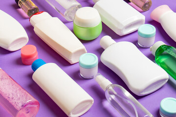 Group of plastic bodycare bottle Flat lay composition with cosmetic products on colored background empty space for you design. Set of White Cosmetic containers, top view with copy space