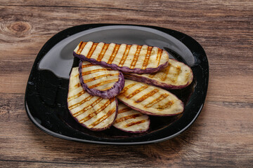 Grilled graffiti eggpant slices with oil
