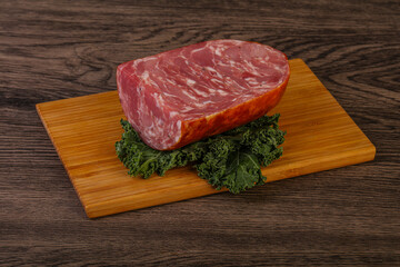 Beef ham piece over board