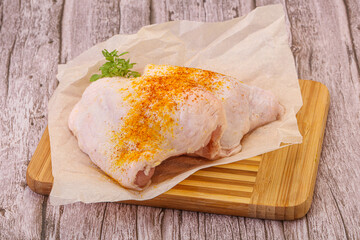 Raw chicken thigh with spices