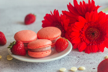 Macaroons. Delicious french desserts. Macaroons on the table. Macaroons with strawberries