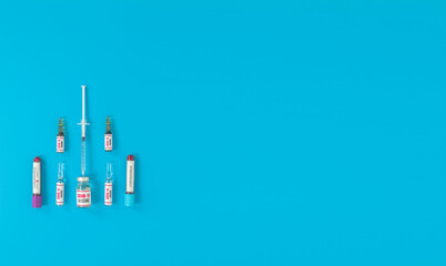 The drug for the coronavirus (covid 19) pandemic virus on a blue background. Sample vaccines and drugs used in the treatment of coronavirus.