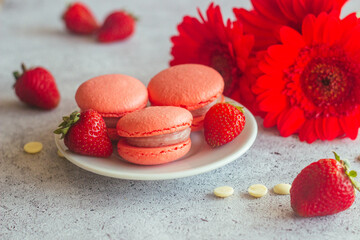 Macaroons. Delicious french desserts. Macaroons on the table. Macaroons with strawberries