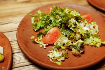 Greek salad on wooden background top view. Space for text. Healthy food