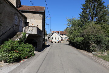 Fototapeta na wymiar Nice view over a typical road through a small French village with Mediterranean houses.