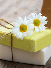 Fototapeta na wymiar Soap bars chamomile, closeup view. Natural herbal beauty products