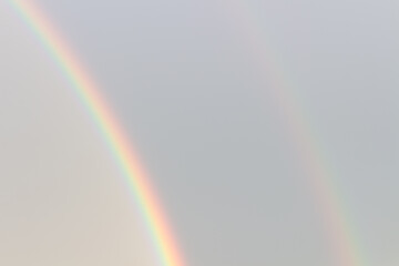 double rainbow on dark blue evening sky, background
